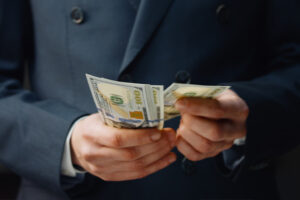 Loan signing agent holding money