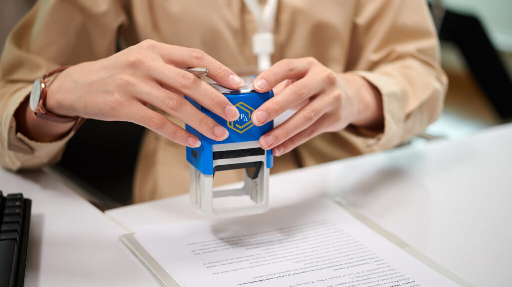 A Notary Public using a Notary Public Association Stamp