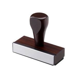 Traditional handle notary stamp with wooden grip, designed to meet state specifications, requires a separate stamp pad for use.